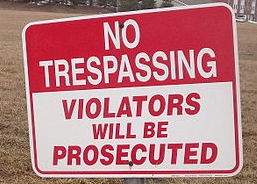 http://commons.wikimedia.org/wiki/File:No_Trespassing_sign_at_empty_lot_in_February.JPG