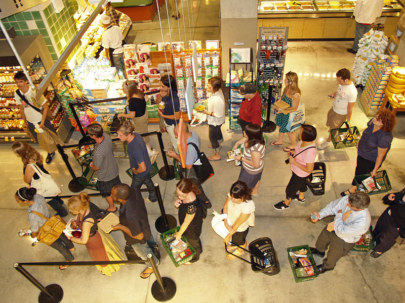 http://commons.wikimedia.org/wiki/File:Waiting_in_line_at_a_food_store.JPG