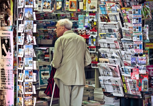 https://commons.wikimedia.org/wiki/File:An_old_man_in_newsagent%27s_shop,_Paris_September_2011.jpg