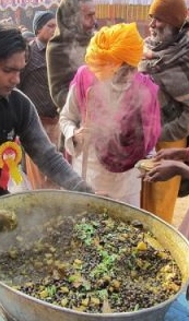 http://commons.wikimedia.org/wiki/File:Free_Food_Distribution_-_Gangasagar_Fair_Transit_Camp_-_Kolkata_2012-01-14_0691.JPG