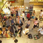 http://commons.wikimedia.org/wiki/File:Waiting_in_line_at_a_food_store.JPG