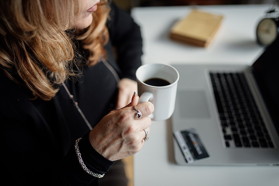https://commons.wikimedia.org/wiki/File:Beautiful_middle-aged_woman_drinking_coffee_in_a_office_closeup.jpg