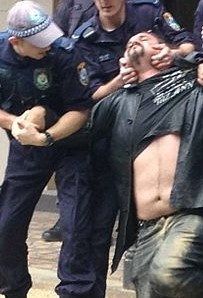 https://commons.wikimedia.org/wiki/File:NSW_police_use_illegal_pain_hold_on_activist_at_University_of_Sydney.JPG